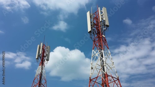 Red and white towers meet sky