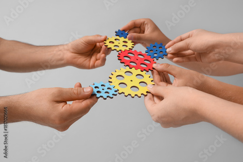 Many hands with colorful ge...
