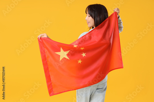 Young Asian woman with flag...