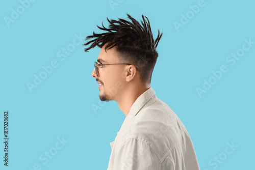 Young man with dreadlocks a...