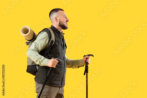 Young man with walking pole...