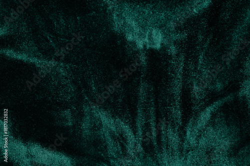 Rich green velvet fabric with unique texture and pattern details
