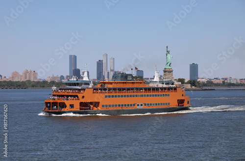 ferry sailing from manhattan to staten island for free for tourists and commuters who can see the famous statue of liberty
