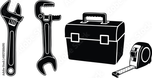 Tools including wrench, adjustable spanner, toolbox, and measuring tape for home improvement projects or DIY tasks 