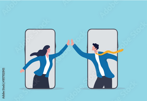 Virtual hi five for success collaboration, remote working or online greeting for business achievement, online video conference concept, happy businessman and businesswoman hi five from mobile phone. 