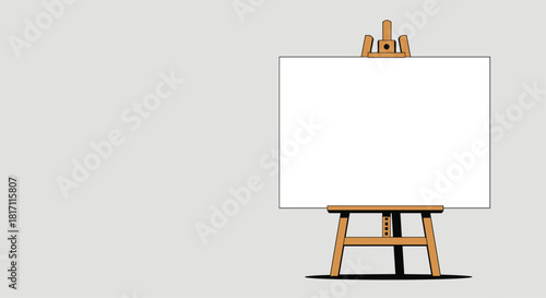 Wooden artist easel standing with a blank white canvas ready for painting or a message with ample copy space on a gray background.