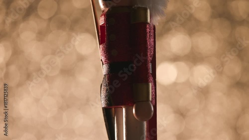 Colorful bokeh studio backdrop highlights a spinning Toy Nutcracker, finishing with a detailed head shot