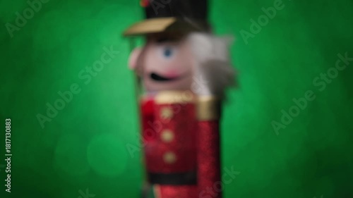 Bright green bokeh background sets the stage as the Toy Nutcracker spins with a little smoke around it, ending with an up-close head shot.
