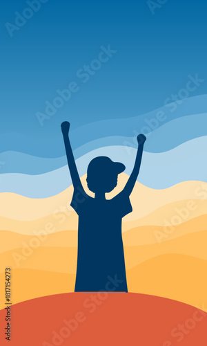  A boy with his arms raised against a sunny landscape