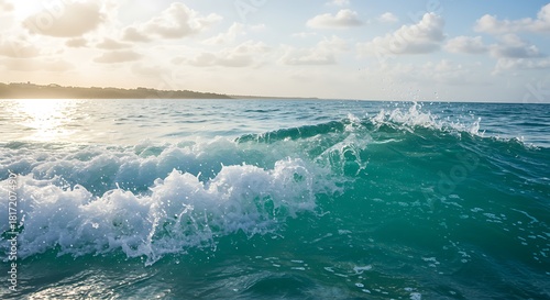 Fototapeta Naklejka Na Ścianę i Meble -  Beautiful ocean wave rolling toward the shore on sunny day vacation