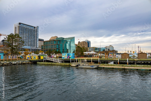 A scenic view of Halifax's bustling waterfront with modern architecture and a serene harbor.