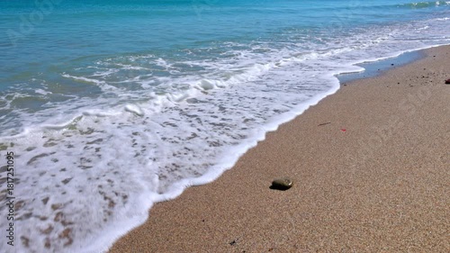 Beautiful view of Aegean Sea waves with natural stereo sound on pebbled beach background. Kos. Greece.