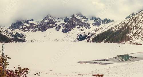Fototapeta Naklejka Na Ścianę i Meble -  Frozen Lake Morskie Oko or Sea Eye Lake in Poland at Winter. Panoramic view