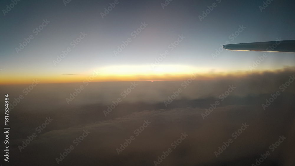 custom made wallpaper toronto digitalAirplane contrails during flight and the sunset, view from the airplane window
