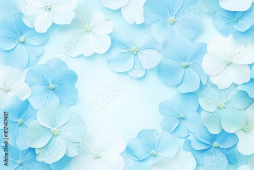 Blue and white flowers arranged beautifully on a soft blue background with ample copy space