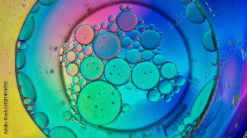 Psychedelic colorful oil and water bubbles moving