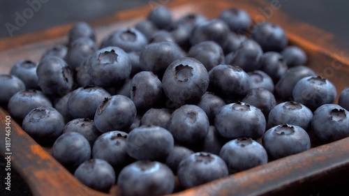 Wallpaper Mural A close-up shot of a wooden plate overflowing with fresh, ripe blueberries. The blueberries are a vibrant blue color and appear juicy Torontodigital.ca