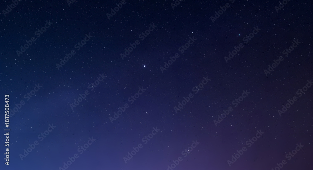 Obraz premium A dark blue night sky filled with countless twinkling stars, creating a serene and vast cosmic landscape.