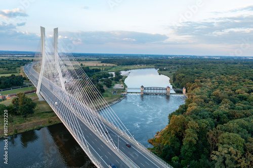 Road bridge with pylons, large road bridge and dam in the background. Wroclaw, Poland