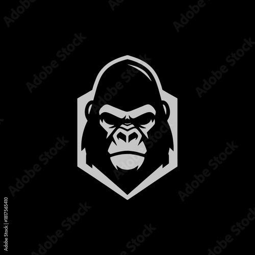 A stylized gorilla head in a hexagonal frame, presented in grayscale on a black background.