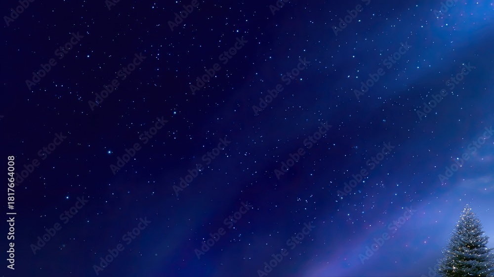 Naklejka premium Starry Night Sky with Distant Stars and a Pine Tree Silhouette Against a Deep Blue Background in a Serene Winter Landscape