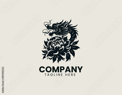 Fierce black oriental dragon icon wrapped majestically around a large blooming peony or chrysanthemum flower.