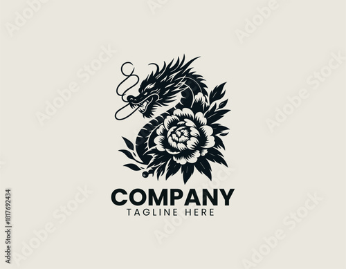 Fierce black oriental dragon icon wrapped majestically around a large blooming peony or chrysanthemum flower.