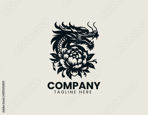 Fierce black oriental dragon icon wrapped majestically around a large blooming peony or chrysanthemum flower.