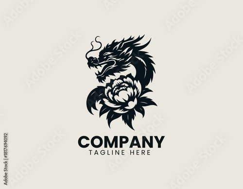 Fierce black oriental dragon icon wrapped majestically around a large blooming peony or chrysanthemum flower.