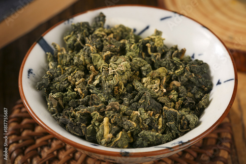 Dried Green Tea Leaves in Bowl - Traditional Herbal Beverage Ingredient for Health and Wellness