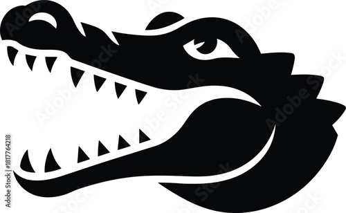 Fierce black silhouette of an alligator head with open jaws and sharp teeth