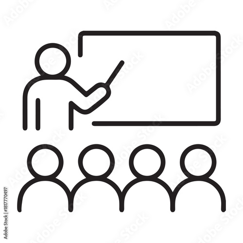 Teacher pointing at a blank whiteboard with students sitting in front