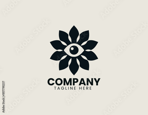 Minimalist black flower icon with an eye symbol in its center, on a light cream background