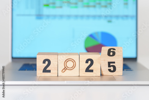 2025 end year to Happy New Year 2026 block with magnifying glass icon against laptop computer. SEO, Search Engine Optimization, hiring , Advertising, Strategy, marketing, Keyword, Content and New year