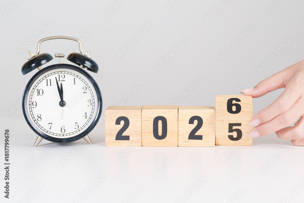 Obraz premium 2025 end year to Happy New Year 2026 with vintage alarm clock. Christmas, New Start, Resolution, countdown, Goals, Plan, Action and Motivation Concept