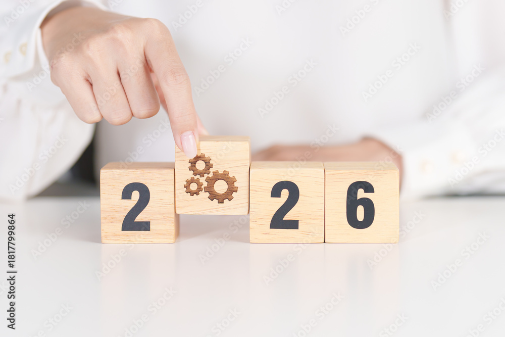 Naklejka premium 2026 year block with gear icon. Business Process, Team, teamwork, Goal, Target, Resolution, strategy, plan, Action, motivation, change, brainstorm and New Year start concepts