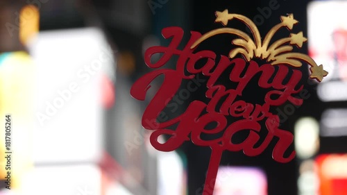 Happy New Year text sign on Times Square in New York City, United States. Illuminated screens during Christmas holidays in December on Manhattan. Festive celebration on Broadway in USA. Glowing lights