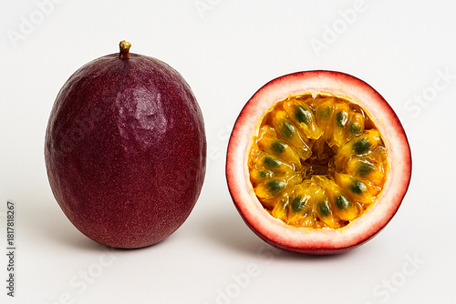 Fresh passion fruit with yellow juicy seeds inside purple shell.