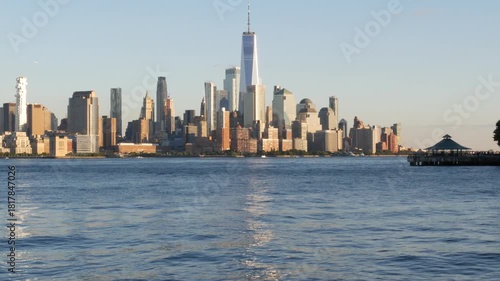New York City Manhattan Downtown Financial District skyline, World Trade Center tower from New Jersey, Hoboken pier, United States of America. River waterfront urban cityscape with skyscraper building