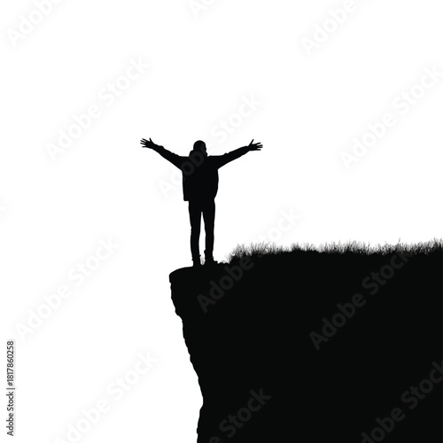 Person with arms outstretched on cliff edge silhouette grass