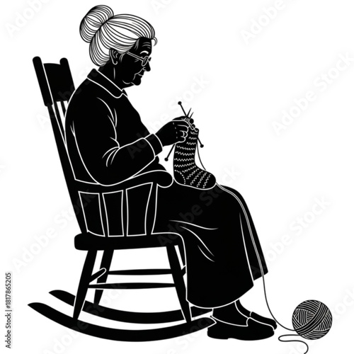 Silhouette of an elderly woman knitting a sock in a rocking chair.