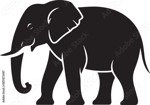 Silhouette of an african elephant standing with its trunk curled