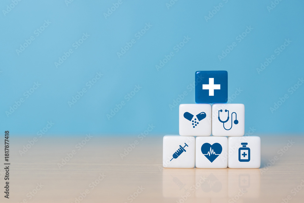 Obraz premium Health insurance concept, dice with healthcare medical icons on blue background, copy space