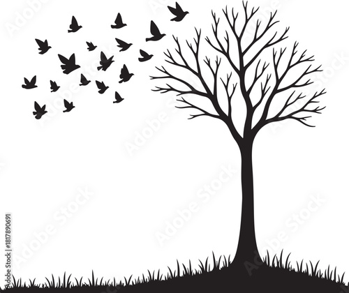 Black silhouette of a bare tree with birds flying away