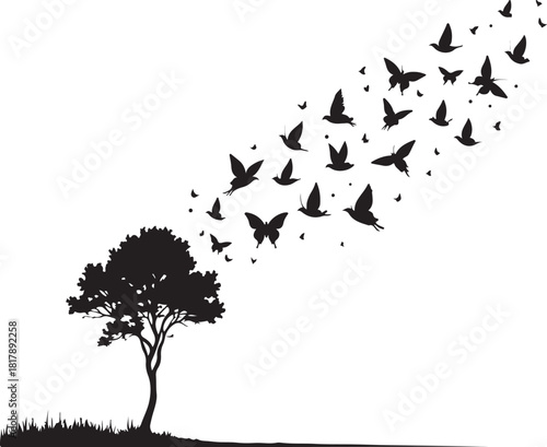 Black silhouette of a tree with birds and butterflies flying away