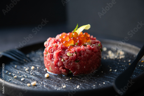 Fotografía Gourmet Beef Tartare with Ikura and Yolk on Dark Plate
