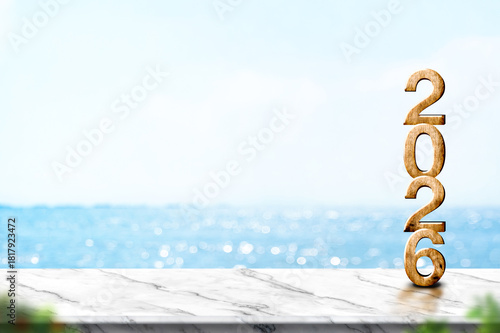 2026 happy new year wood number (3d rendering) on marble table with summer sea view ,leave space for display of product for promotion on Christmas and new year holiday