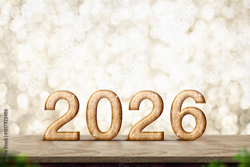 2026 happy new year wood number (3d rendering) on wood table with sparkling gold bokeh wall,leave space for display of product for promotion on christmas and new year holiday