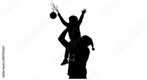 Silhouette of a child on fathers shoulders decorating for Christmas.