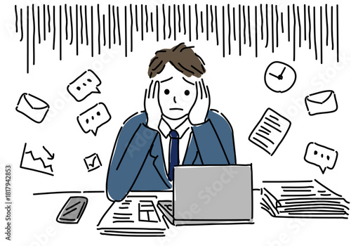 業務に追い詰められるビジネスマン
